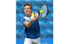 EASTBOURNE, ENGLAND - JUNE 14: Scott Clayton of Great Britain plays a forehand against Chris Guccione of Australia during their Men's Singles qualifying match on day one of the Aegon International at Devonshire Park on June 14, 2014 in Eastbourne, England.  (Photo by Steve Bardens/Getty Images)